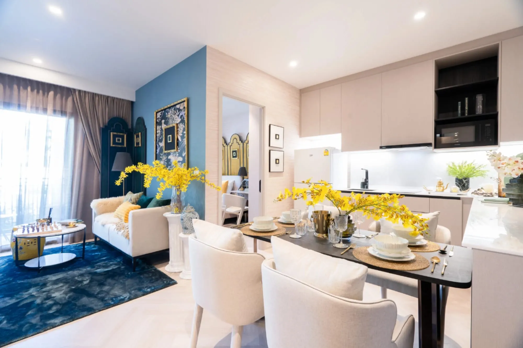 Dining table and kitchen in a show unit