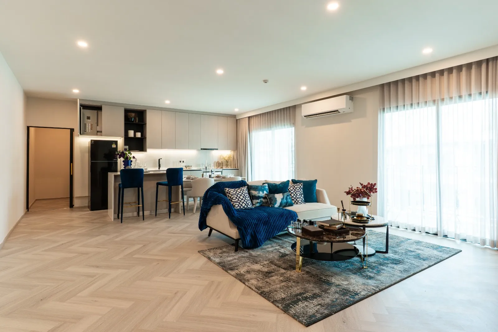 Open-plan living room with herringbone floor